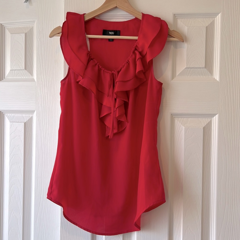Bright pink ruffle front sleeveless blouse